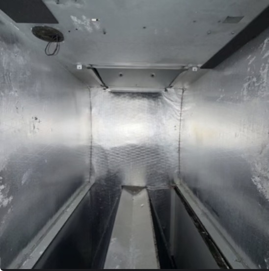 Interior of a clean, foil-lined air handler cabinet